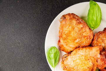 Chicken thighs fried poultry meat dish natural product tasty snack fresh delicious gourmet food background on the table rustic top view copy space