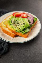 Avocado toast vegetable dish natural product tasty snack fresh delicious gourmet food background on the table rustic top view copy space keto and paleo diet vegan and vegan food