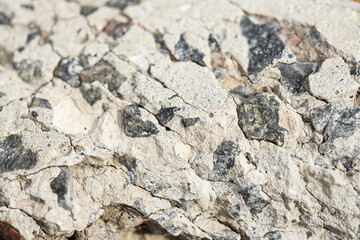 Texture of concrete with crushed stones as background, closeup