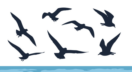 A flock of seagulls soaring gracefully over the ocean waves during a bright sunny day.