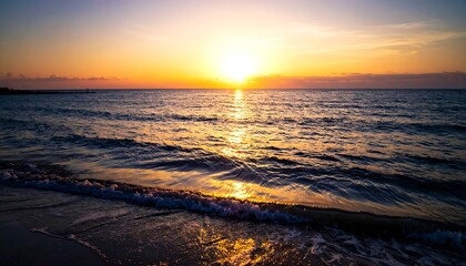 Seaside serenity Sun dips below the horizon, painting the sky and sea in warm hues of orange and purple