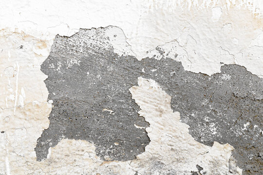 Peeling painted concrete wall. Leaking rain cause the wall cracked. Water damaged the wall.