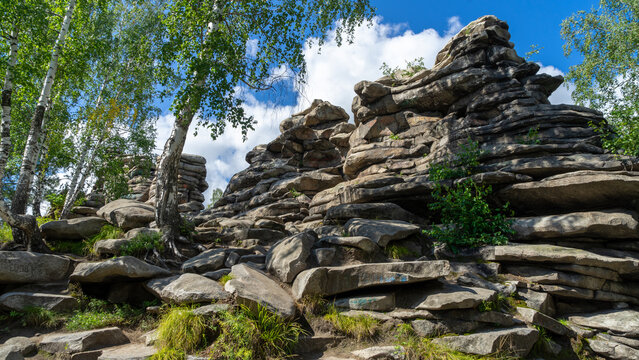 Beautiful Devil's Hillfort complex on sunny summer day. Iset Park, Iset village, Sverdlovsk region, Russia. Hiking and walking