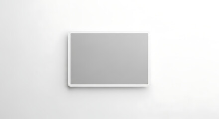 A gray rectangle with a white border is centered on a white wall in a horizontal orientation ai generated