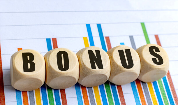  Wooden round blocks with word bonus on colorful business chart background