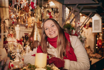 Cheerful caucasian female at festive christmas market
