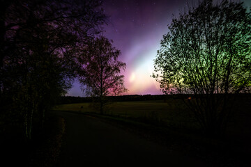 Scenic view of aurora borealis against sky at night