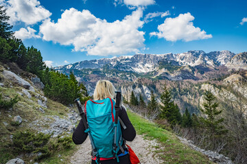 young woman hiking in the mountains
