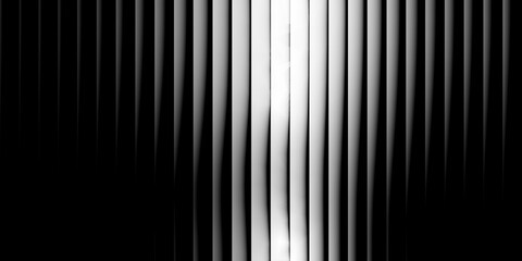 Abstract black and white vertical lines with bright light in the center