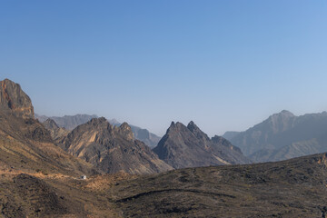 Impressive mountain range in Wadi Bani Awf, a difficult offroad track in Oman with high mountain cliffs