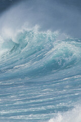 Aqua blue crashing surf on the Maui coast.