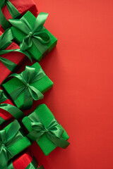 Christmas Green  and Red Gift Boxes on Red Background