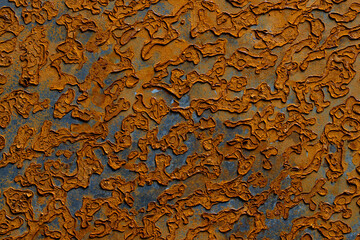 Abstract background with old rusty metal surface, closeup. Orange worn rusty metal texture