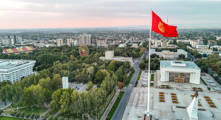 A large national flag waving proudly at Bishek Freedom Square
