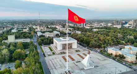 A large national flag waving proudly at Bishek Freedom Square