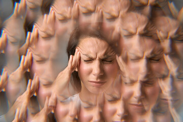 Close-up portrait of woman holding her head in pain with headache effect