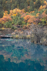 Jiuzhaigou National Park Wooden Boardwalks with Turquoise Lake and Autumn Foliage