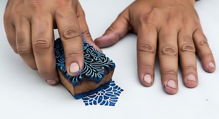 Hands Stamping Fabric with a Traditional Wood Block Print (300) image