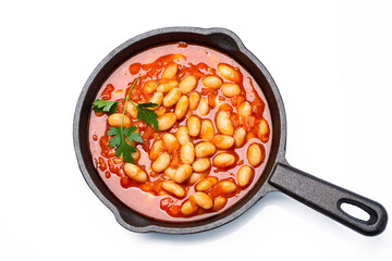 Baked bean dish in cast iron pan on white background. 