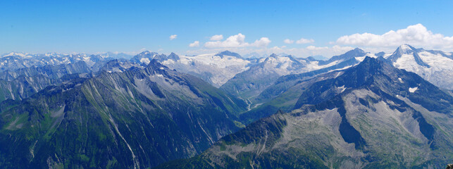View on jagged mountains and glaciers of Zillertal alps on a summer day