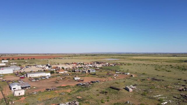 Aerial landscape of abandoned desert car graveyard historic US route 66 San Jon New Mexico NM
