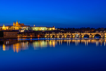 Fototapeta premium Night view of Charles Bridge, Prague Castle, Vltava river in Prague. Architecture and landmark of Prague, postcard of Prague