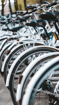 Row of bicycles parked side by side, ready for use or storage