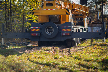 A truck crane prepared for handling an object.