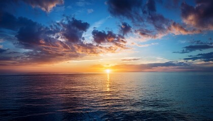 Tranquil Ocean Sunset With Vibrant Clouds Over Calm Water Evening Serenity Captured Outdoors
