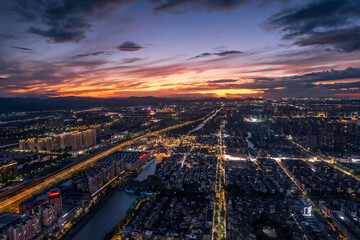 Shaoxing City Sunset Skyline Over Flowing Rivers and Illuminated Streets
