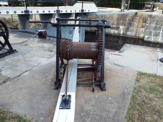 A close-up photograph of one of the winches or winding mechanisms used to operate the lock gates at the Hogs Back Locks on the Rideau Canal..

