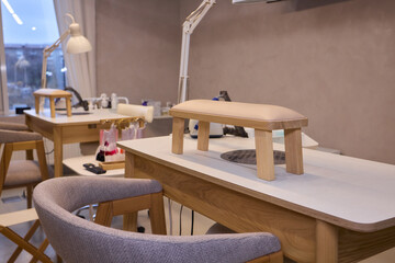 Bright salon setup, Sunshine filled nail station, Well-organized manicure area with city view, Light filled beauty salon featuring organized stations and comfortable environment