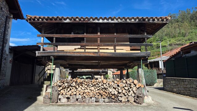 Traditional asturian horreo in Bue&ntilde;o, Spain with firewood storage