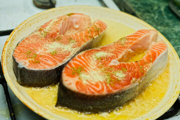 Seasoned Salmon Fillets Garnished With Lemon Zest On Metal Tray
