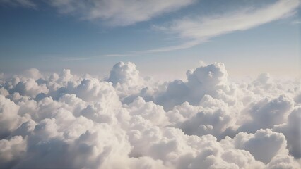 Above the clouds: Serene aerial view of fluffy white cumulus clouds stretching to the horizon under a clear blue sky