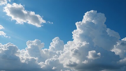 Sunny blue sky with majestic white cumulus clouds, perfect weather backdrop