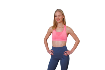 Healthy young woman smiling, wearing sportswear, standing confident with hands on hips, transparent background