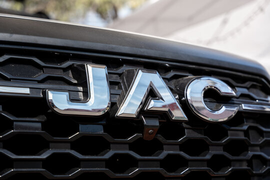Silver emblem of the Chinese brand JAC (owned by JAC Motors) centered on the front grille of one of its trucks. Jalisco, Mexico, Nov. 10, 2025.