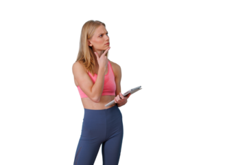Woman holding a tablet and thinking about her fitness plan, looking confused with a transparent background
