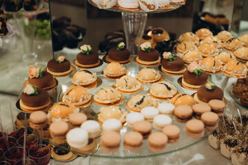 Dessert buffet presenting small cakes and macarons