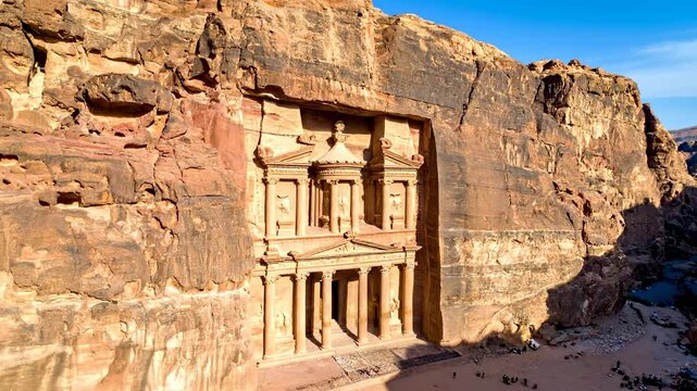 The Ancient Treasury Al Khazneh Carved into Sandstone Cliffs in Petra Jordan.