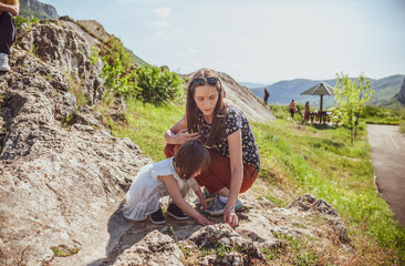 A mother and a daughter bonding in nature