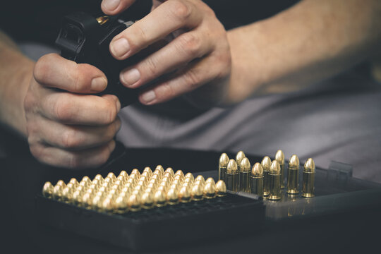 Loading pistol and manipulating with semiautomatic 9 mm pistol details