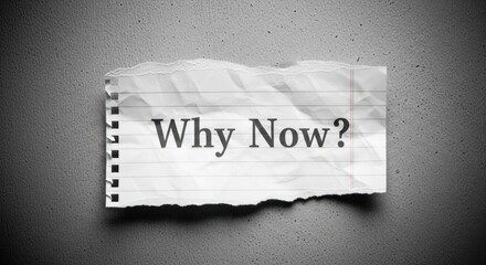 Question 'Why Now?' on crumpled lined paper, torn edges, dark textured backdrop