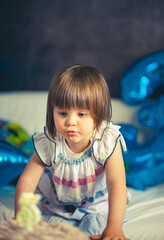 A little girl celebrating her third birthday