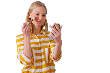 Woman applying blush with makeup brush, looking in compact mirror, transparent background for beauty and cosmetics concepts