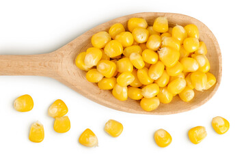 corn seeds in wooden spoon isolated on white background. Top view. Flat lay