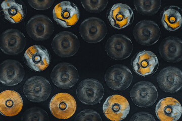 Industrial Pattern of Circular Metal Discs with Orange Accents