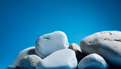 Light Gray Rocks Against A Vibrant Blue Backdrop