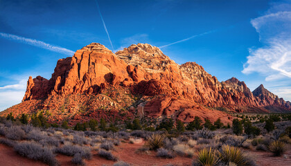 Stunning Red Rock Mountain Rises Uniquely Its Vivid Color And Shape Creating Breathtaking Natural Beauty